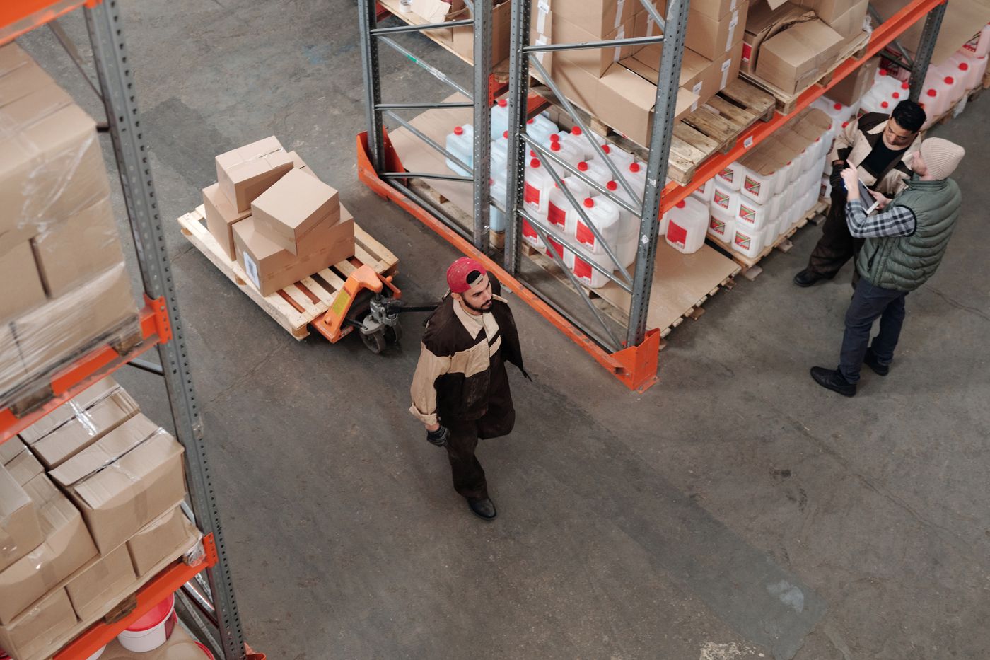 Warehouse employees reviewing cargo information together