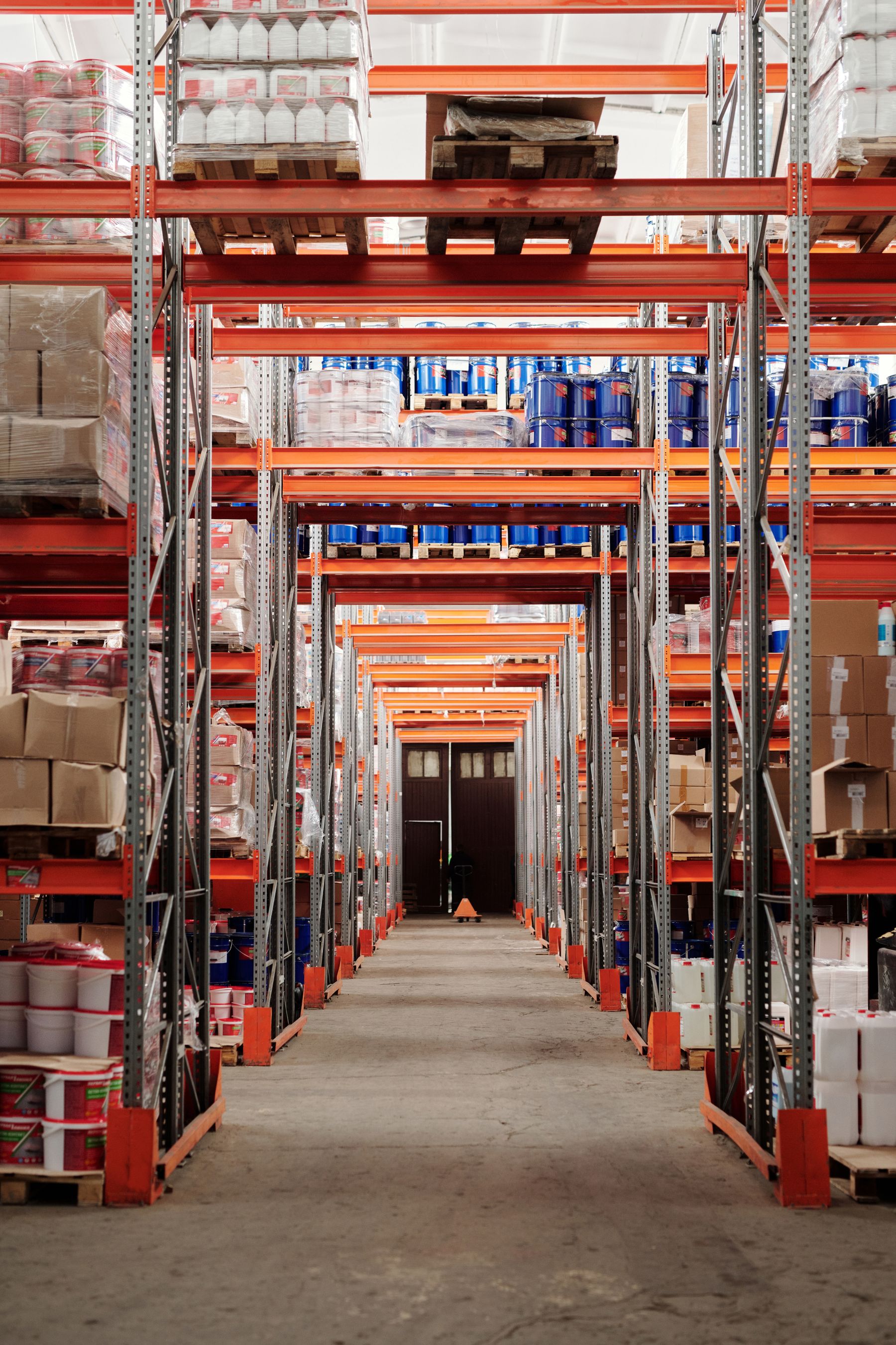 Palletized goods organized on tall warehouse storage racks